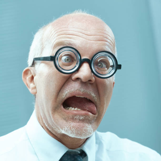 istock Senior businessman making a funny face with thick round glasses 2178291816