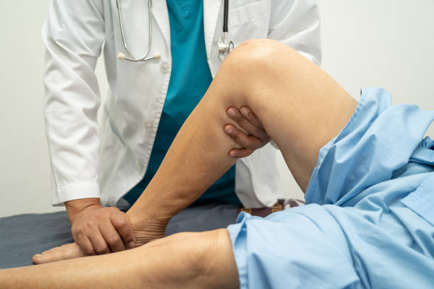 istock Doctor check Asian elderly woman patient knee joint replacement Suture wound surgery arthroplasty on bed in hospital, 2178292148