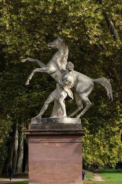 istock Statue of man and horse in park 2178292943