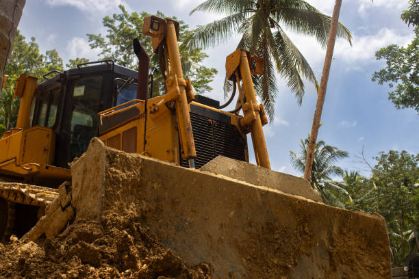 istock A bulldozer worker is building a water supply system on a tropical island. Loose soil 2178294564