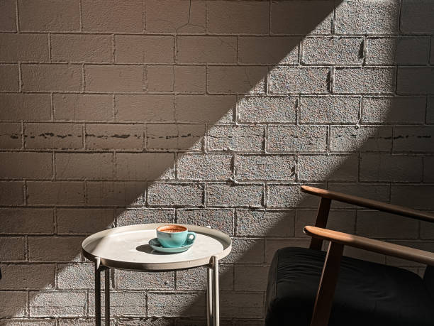 A cup of coffee on white color round coffee table