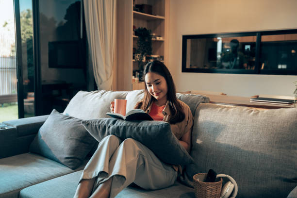 istock Generation Z Woman Taking a Break from Technology with a Book 2178298544