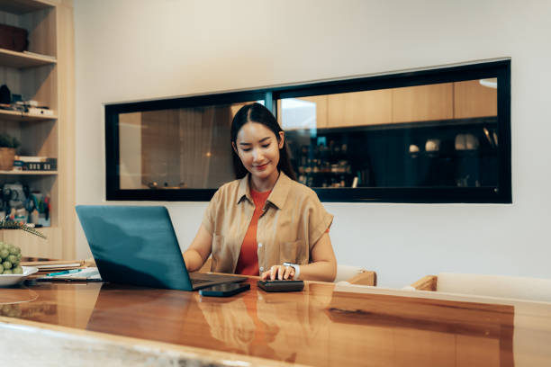 istock Woman Balancing Remote Work and Technology at Home Desk. Work-Life Integration 2178298692