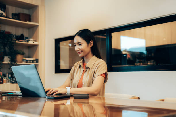 istock Focused Remote Work: Woman Working from Home in Minimalist Office 2178298697