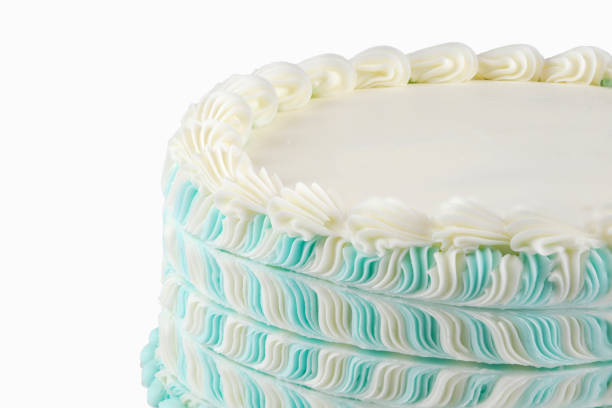 istock Close up on white cream cake isolated on white background 2178299653