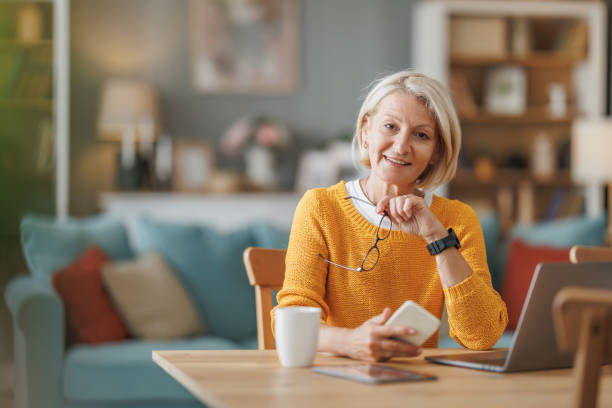 istock Middle-Aged Woman Working from Home on Laptop 2178300029