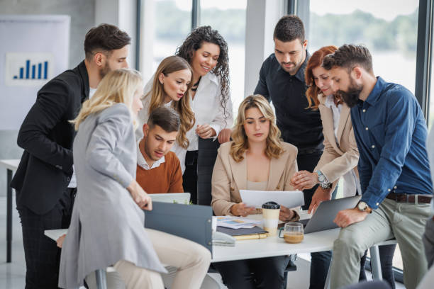 istock Large group of business people engaged in a dynamic meeting 2178301111