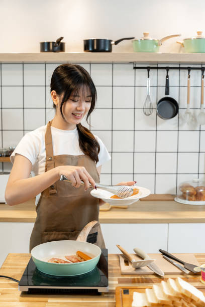 istock An Asian woman is making breakfast content for her followers. 2178301191