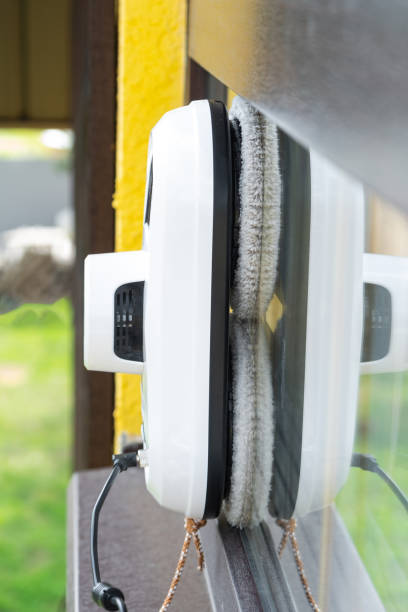 istock A window cleaner robot cleans windows in a house from the outside. Cleaning assistant, safe window cleaning, remote control 2178301251