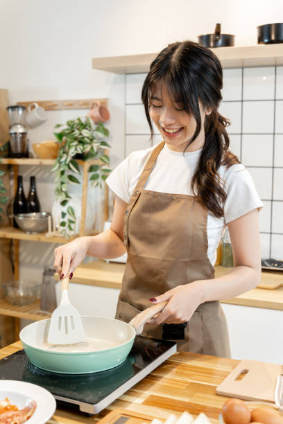 istock An Asian woman is frying eggs for breakfast. 2178301510