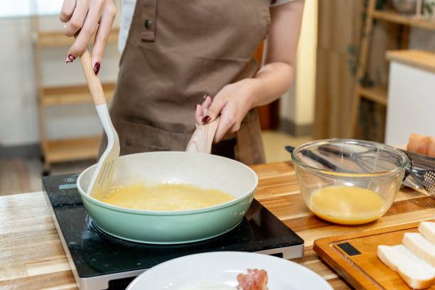 istock Asian woman making omelette for breakfast 2178301525