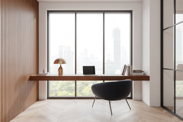 istock Modern home office with city view through large windows, wooden accents. 3D Rendering 2178301815