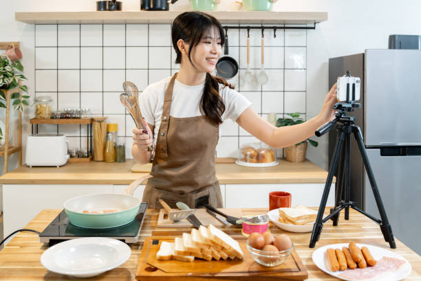 istock An Asian woman is making breakfast content for her followers. 2178302812