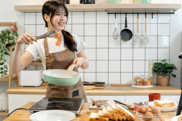 istock An Asian woman is making breakfast content for her followers. 2178302816