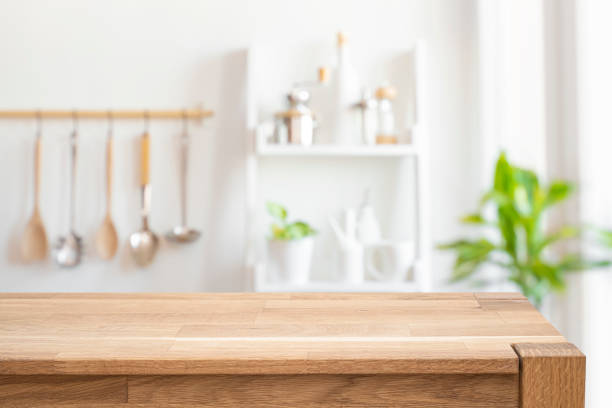 istock Blurred background of rustic kitchen wall interior with wooden table for product display in front 2178302917