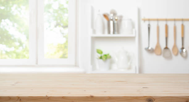 istock Wooden table for product montage with bright blur interior of kitchen 2178302935