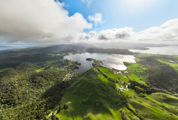 istock Calm lake surrounded by lush greenery during cloudy weather. 2178303201