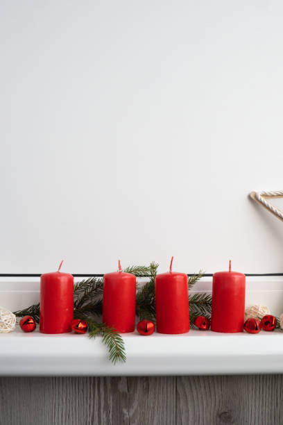 istock Four Advent red candles, fir branches and Christmas zero waste decorations in windowsill. Holiday preparation copy space for text. Catholic traditions of Christmas new year winter 2178303215