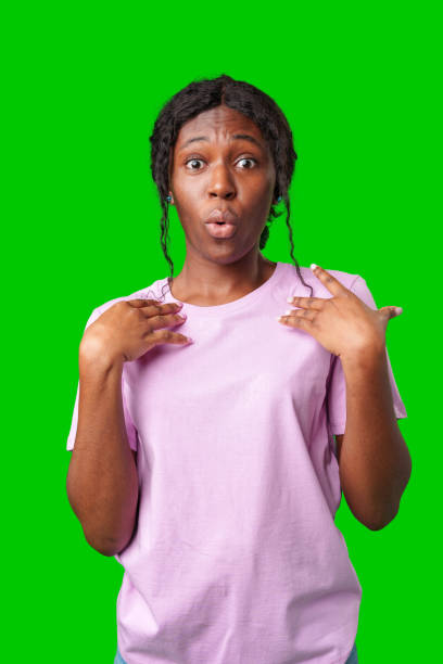istock Woman expressing surprise and excitement on a bright green background 2178303344