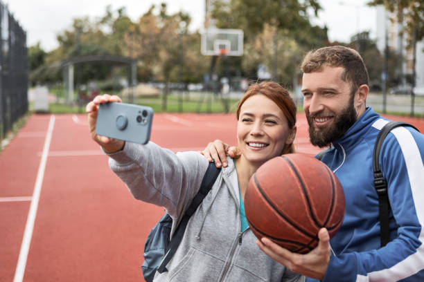 istock Young Couple Taking a Break from Basketball for a Snapshot 2178303965