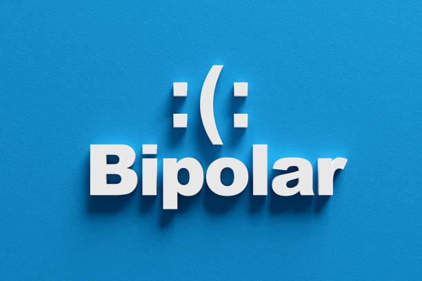Bipolar disorder concept with a happy and sad emoticon, depicting mood swings. 3d render.
