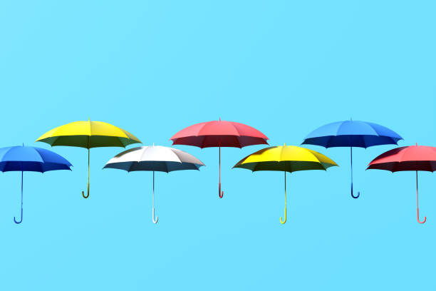 istock Colorful umbrellas floating on a sky blue background 2178304873