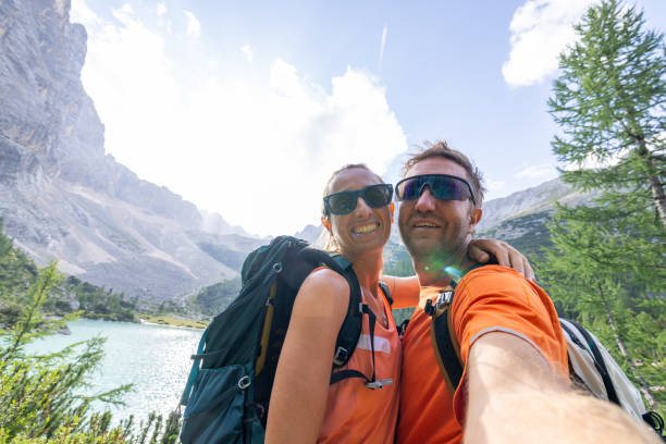 istock Happy Couple Taking Selfie While Hiking in the Mountains 2178305264