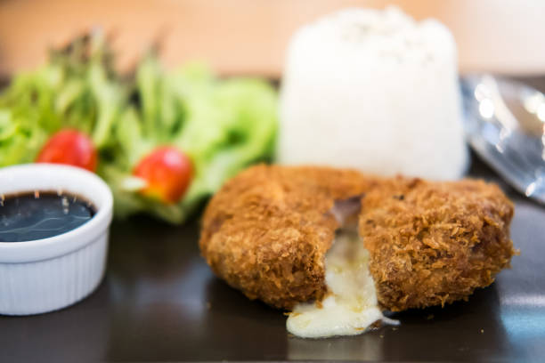 istock cheese tonkatsu pork cutlet with rice and vegetable set, soft focus 2178305289