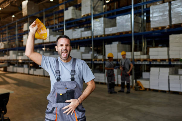 istock Cheerful male worker having fun in storage room. 2178305294