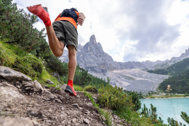 istock Man Trail Running Up Mountain Path with Rocky Peaks 2178305482