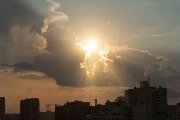 Golden Sunbeams Breaking Through Dark Dramatic Stormy Clouds