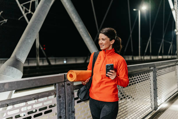 istock Stepping into fitness with tech in hand 2178306719