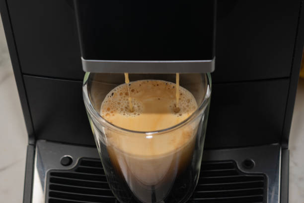 istock A coffee machine is pouring coffee into a glass 2178311968