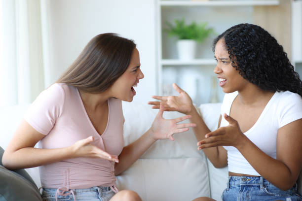 istock Angry interracial friends arguing at home 2178312115
