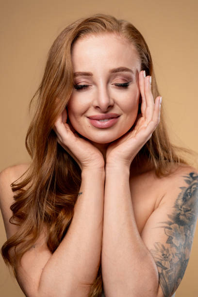 istock Beautiful redhead woman touching her face and smiling 2178312144