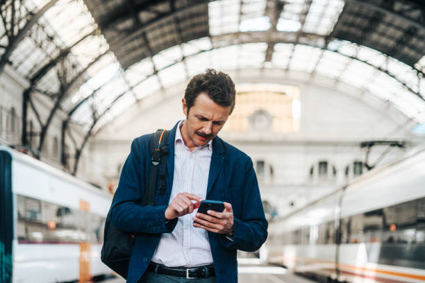 istock Businessman at train station 2178323218