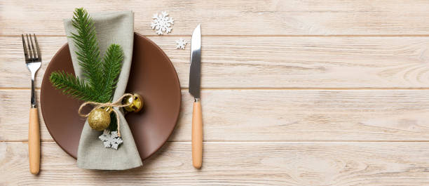 istock Christmas table place setting with christmas decor and plates, kine, fork and spoon. Christmas holiday background. Top view with copy space 2178327295