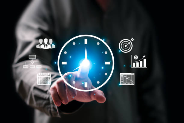 istock Time Management work planning increases efficiency, Businessman  holding clock icon, Business Strategy, Saving working time to reduce costs, Workflow adjustment, Prioritization, Scheduling, Target 2178328056