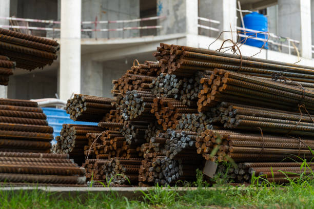 istock Stack of rusty metal reinforcement bars lying outdoors waiting for installation during the construction of a new building 2178328739