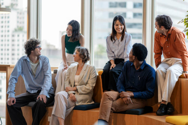 istock A diverse group of multi-ethnic office workers sitting confidently with their relax during break, smiling in a modern office setting. The team exudes professionalism and leadership, embodying teamwork, resilience, and trust in a collaborative business. 2178329622