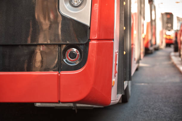 Red bus for public transportation parked on a station.