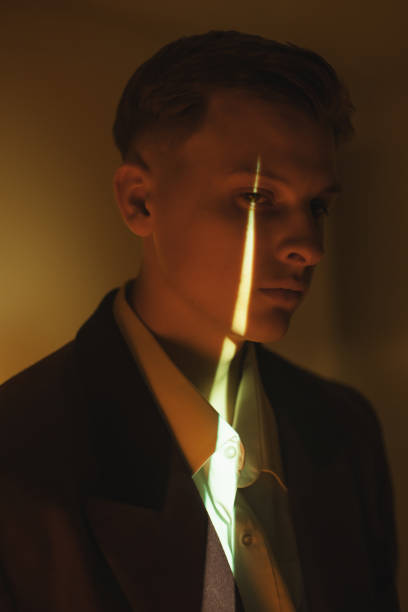 Man in studio. with neon light. Silhouette. Art portrait
