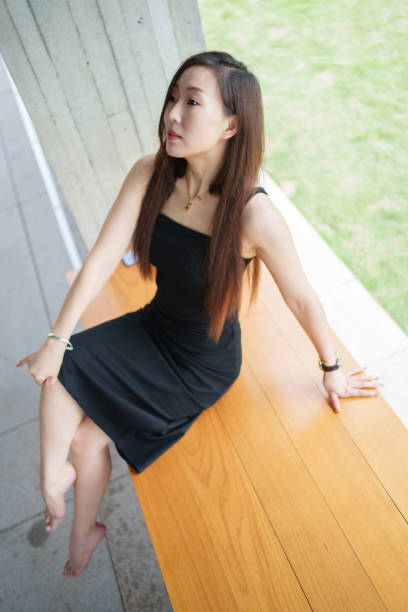 Asian woman sitting in the rest area