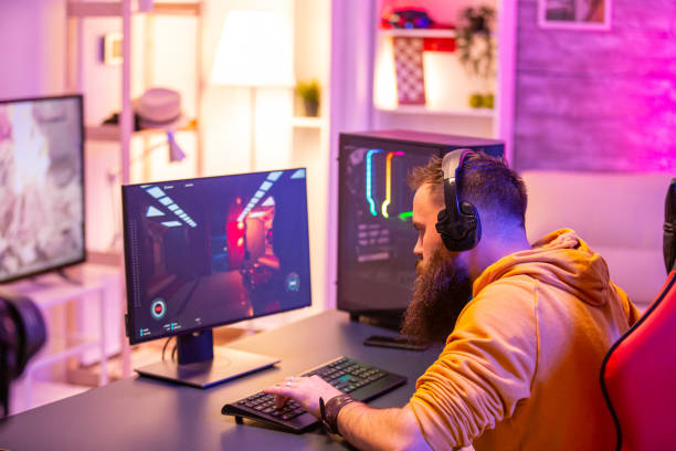 istock Hipster man playing professional video games in his room 2178331477