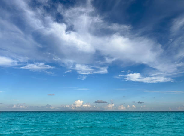 Caribbean tropical turquoise sea with dramatic perfect clouds, a perfect vacation destination in Mayan riviera