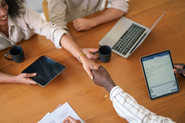 istock Diverse Business Professionals Initiating Meeting with Handshake 2178334903