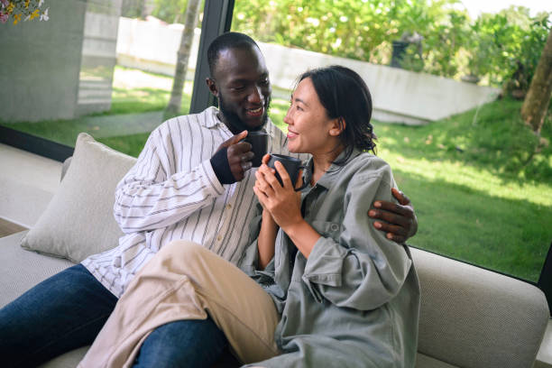 istock Affectionate Couple Enjoying Coffee Together at Home 2178335531