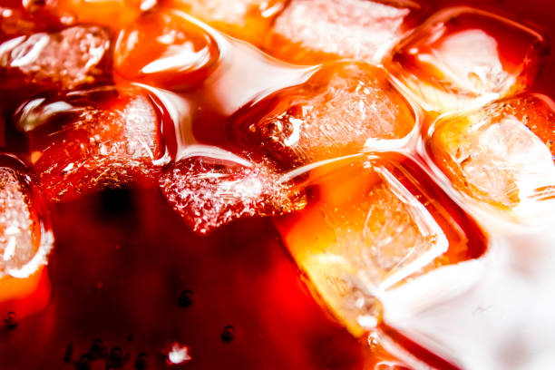 istock close-up of a cola drink with ice cubes 2178336244
