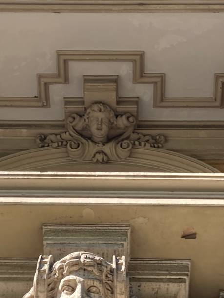 istock Allegorical sculptural head  above doorway. 2178336754