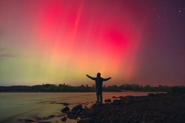 istock Male silhouette against Northern Lights. Aurora Borealis 2178337816